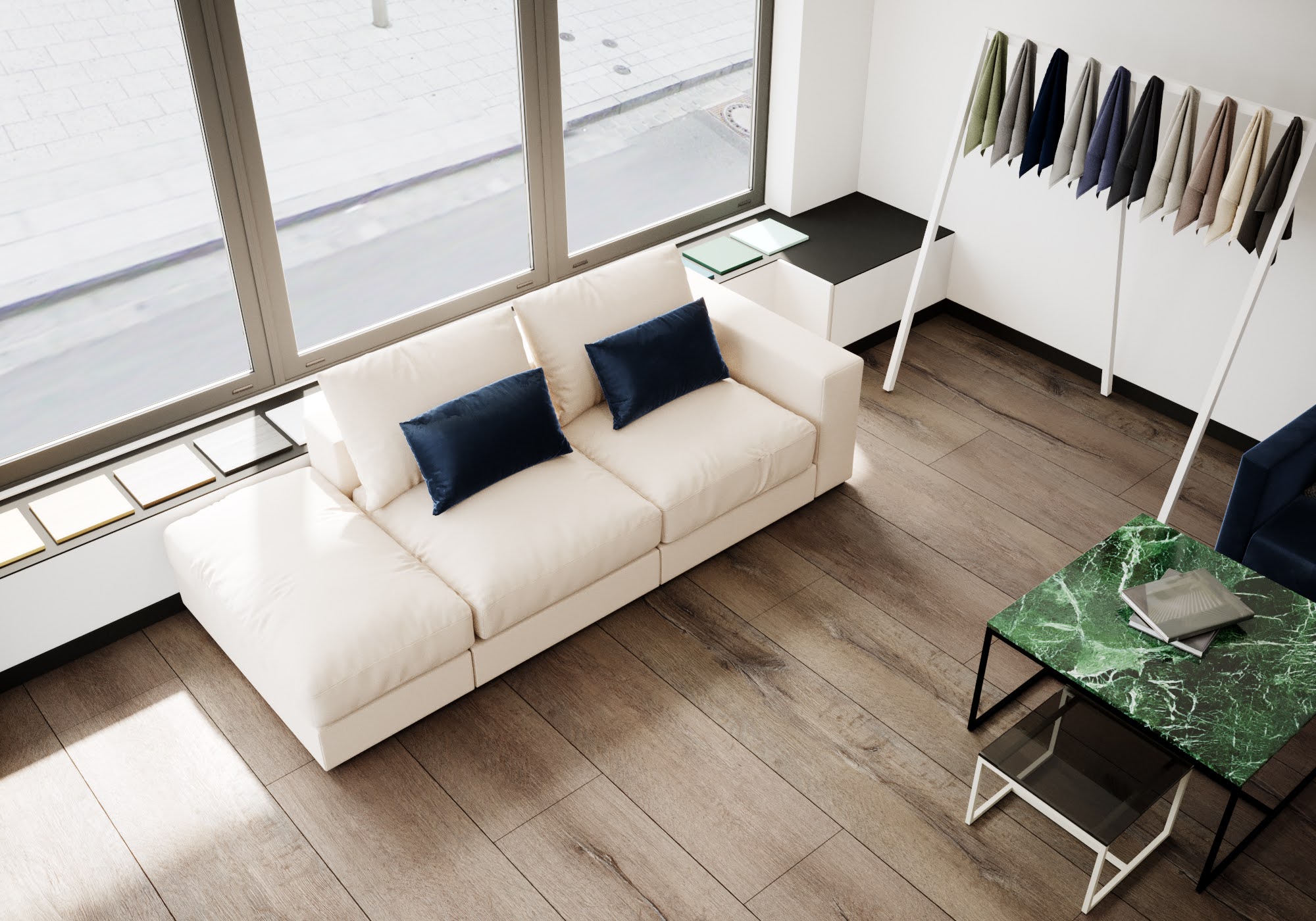 Ein Foto von einem MYCS-Showroom mit einem Sofa und Stoffmustern.